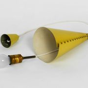 Rare Mid Century Modern cone shaped pendant lamp made of sheet steel in yel