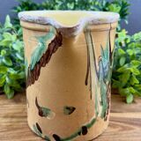 Large vintage ceramic pitcher with abstract green and brown decoration.
