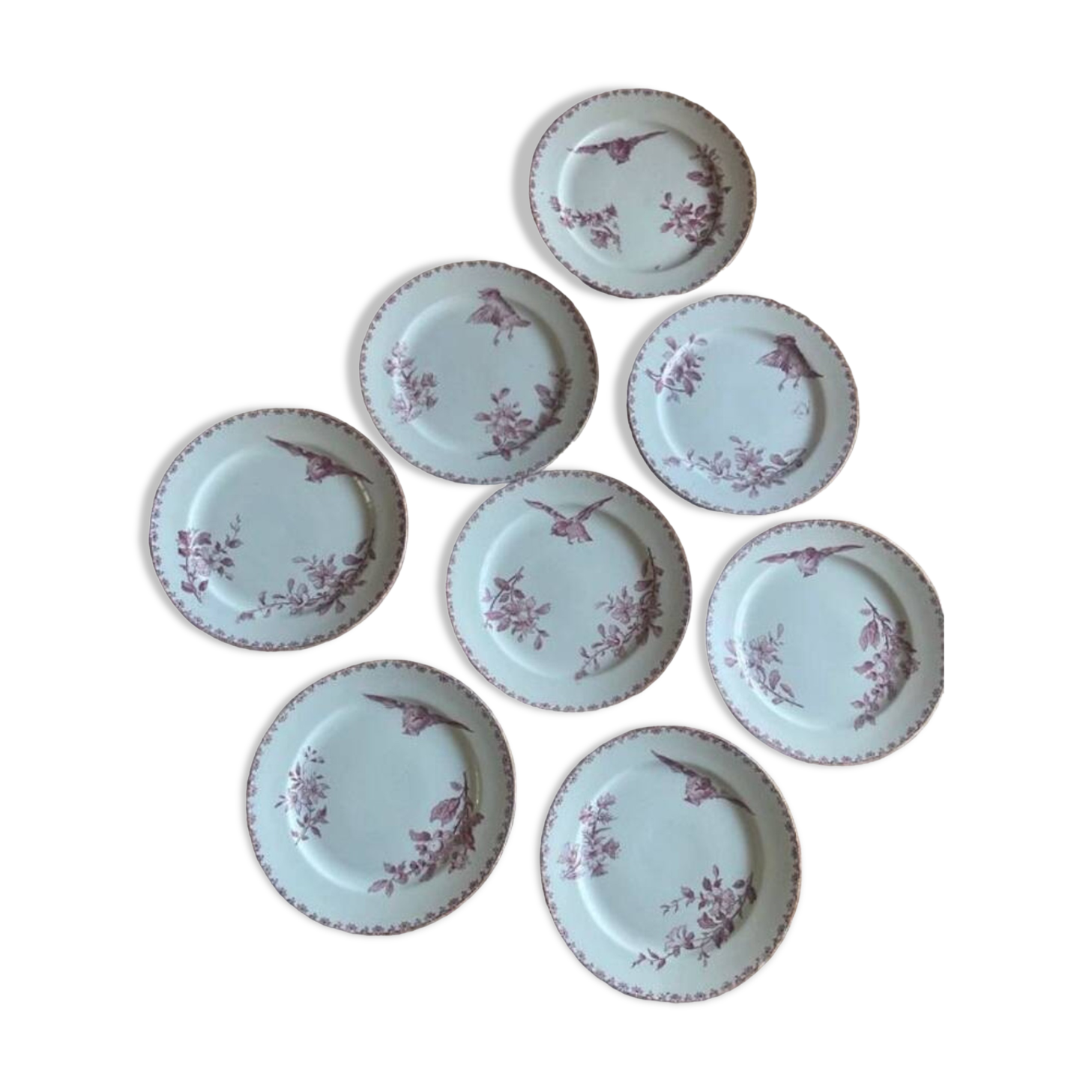 A series of eight flat plates in Terre de fer earthenware, Favori aux oiseaux model - pink tint