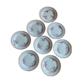 Une série de huit assiettes plates en faïence Terre de fer modèle Favori aux oiseaux - teinte rose