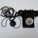 Old ptt phone with rotary dial in black bakelite