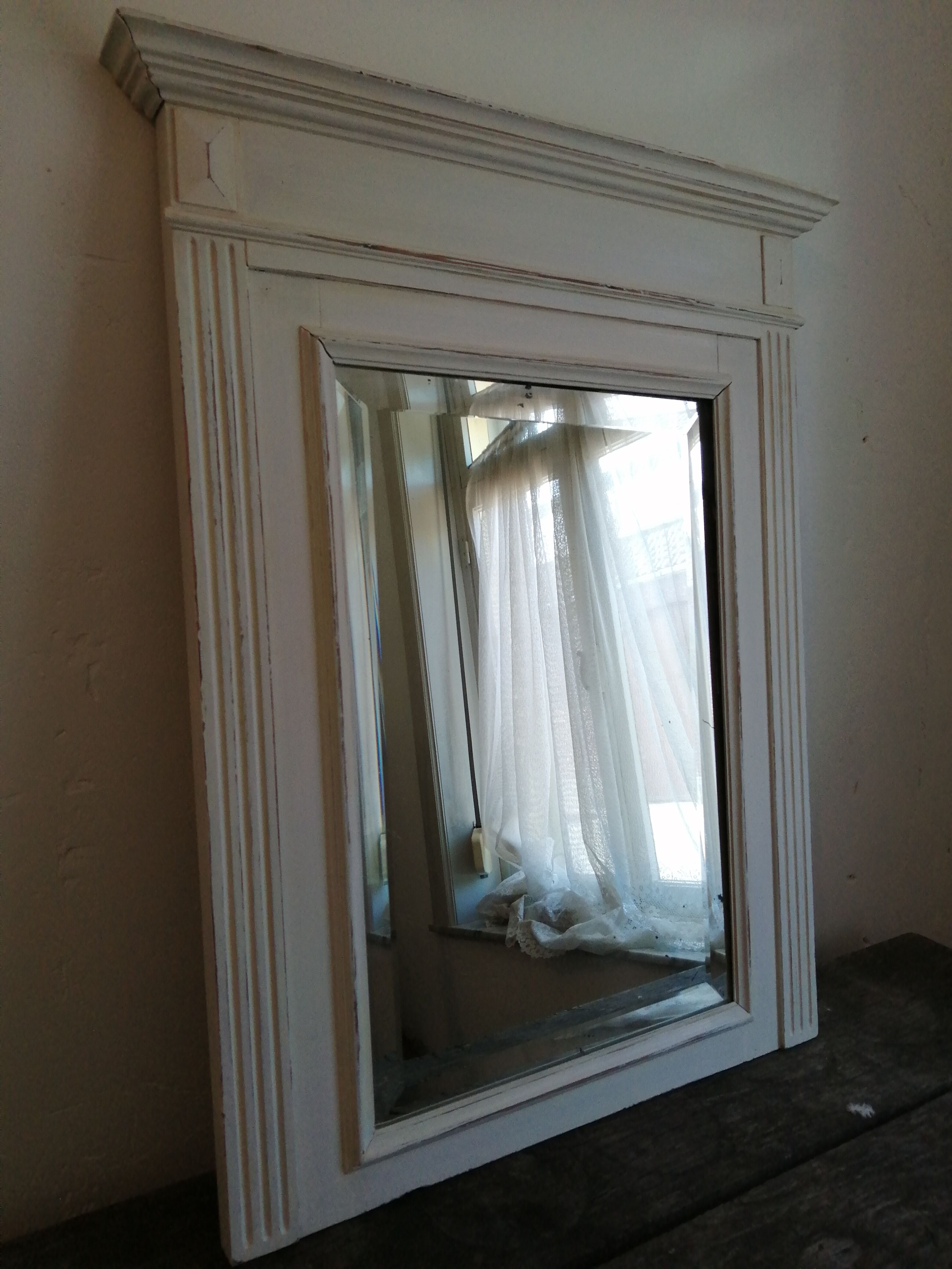 Beveled fireplace mirror