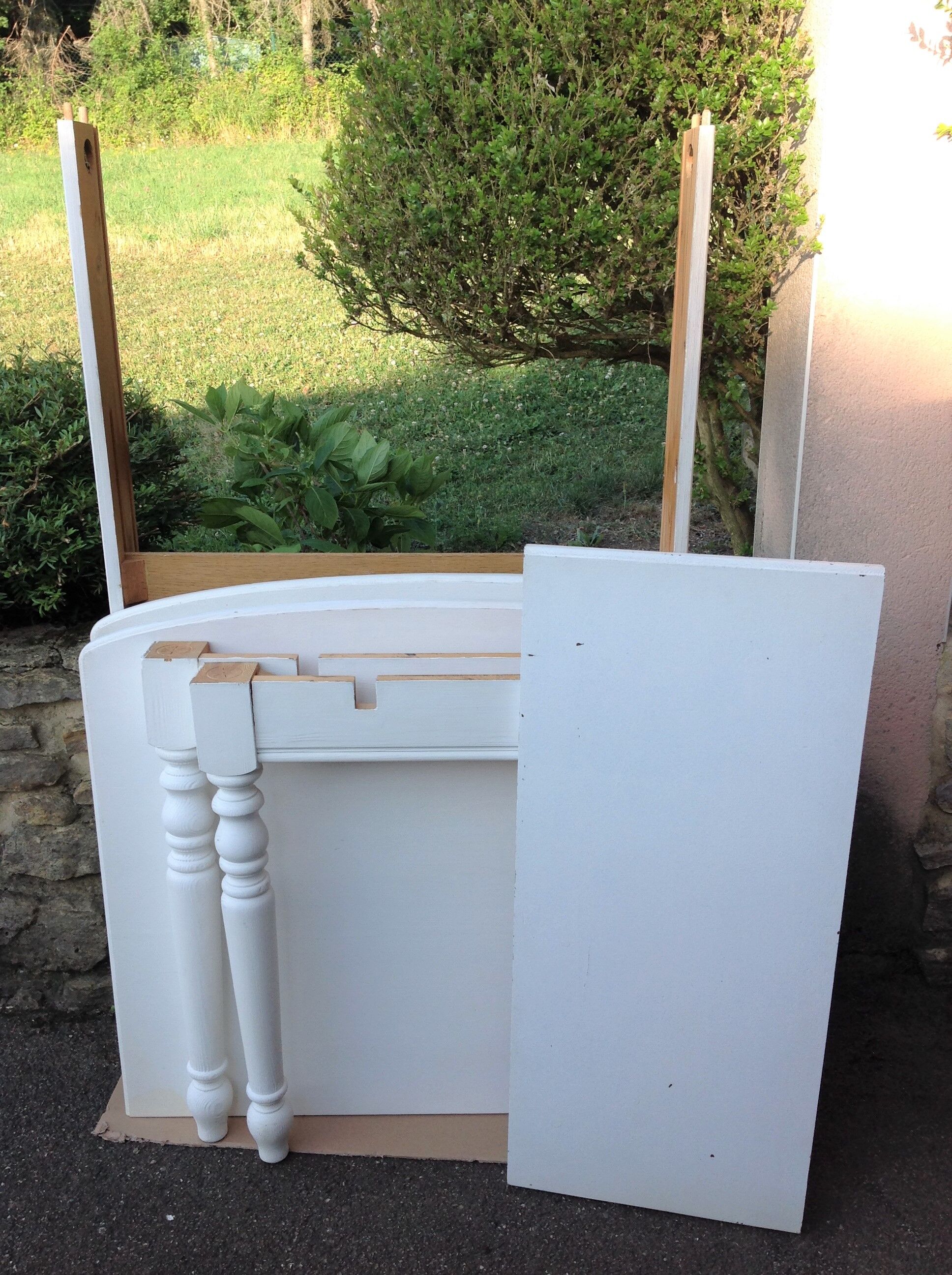 White farmhouse table set and four chairs