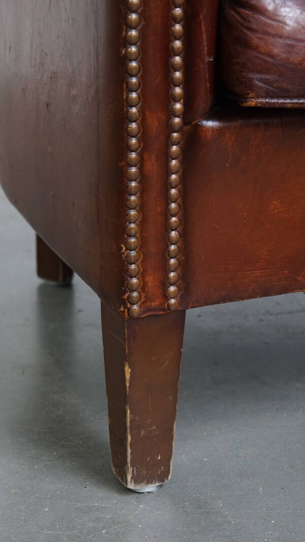 Fauteuil club en cuir de mouton couleur cognac