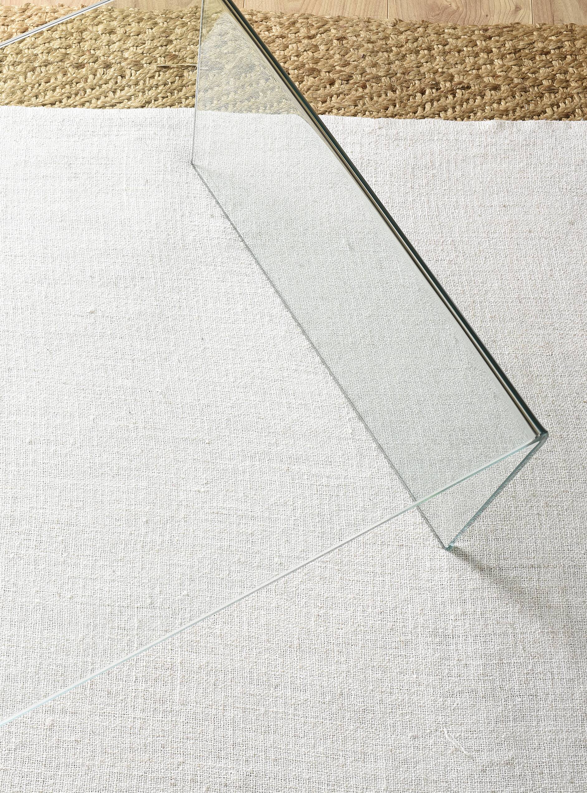 Transparent tempered glass coffee table.