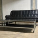 Table basse design vintage chrome et verre fumé noir sur roulettes