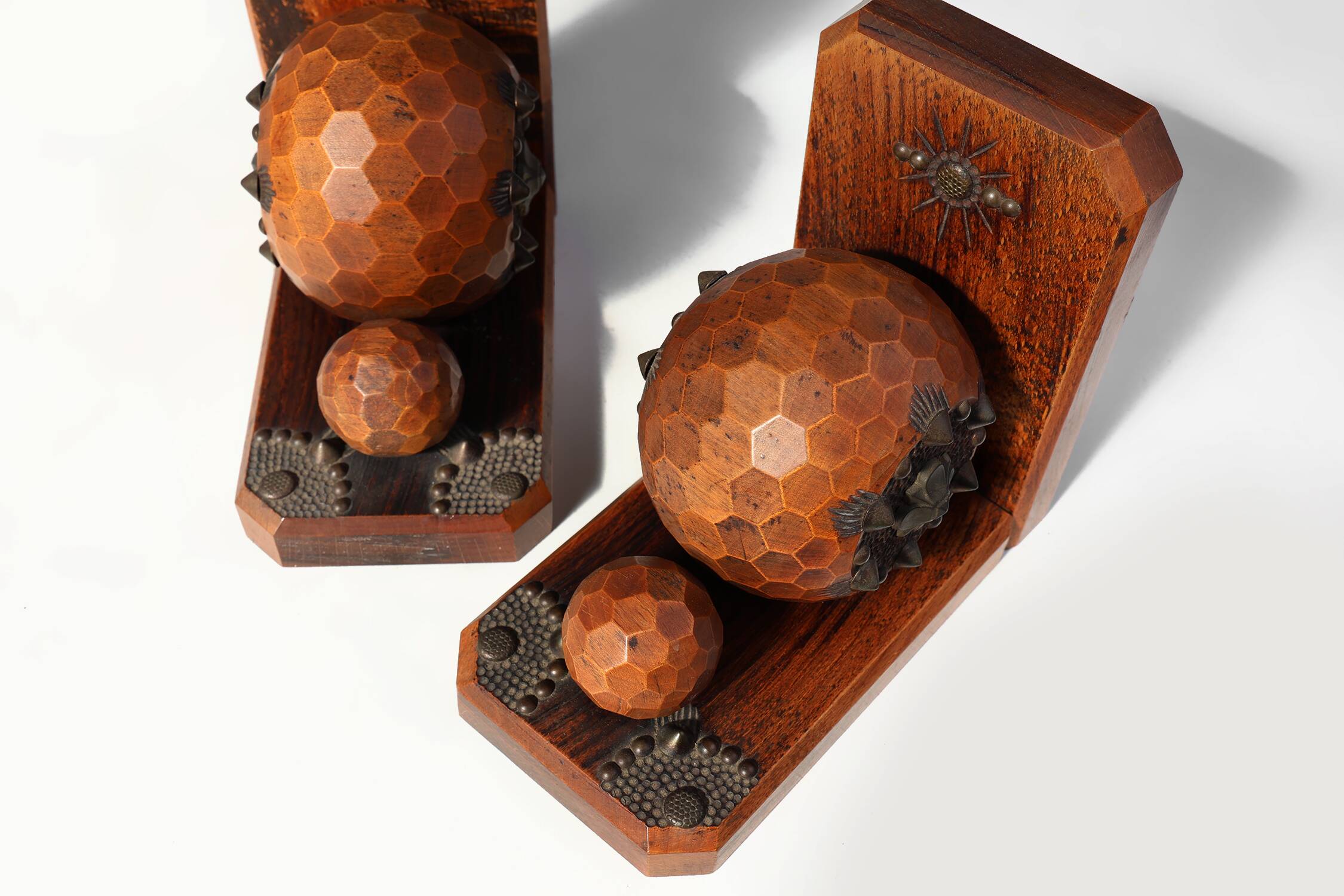 Pair of Art Deco faceted ball bookends in oak with metal decorations