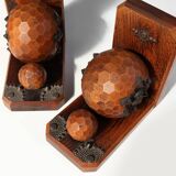 Pair of Art Deco faceted ball bookends in oak with metal decorations