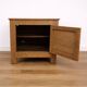 Oak side cabinet with carved motifs