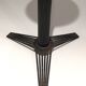 Brass ashtray on a stand made of black lacquered metal wire.