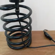 Spring lamp from the 1980s, design by Ingo Maurer.