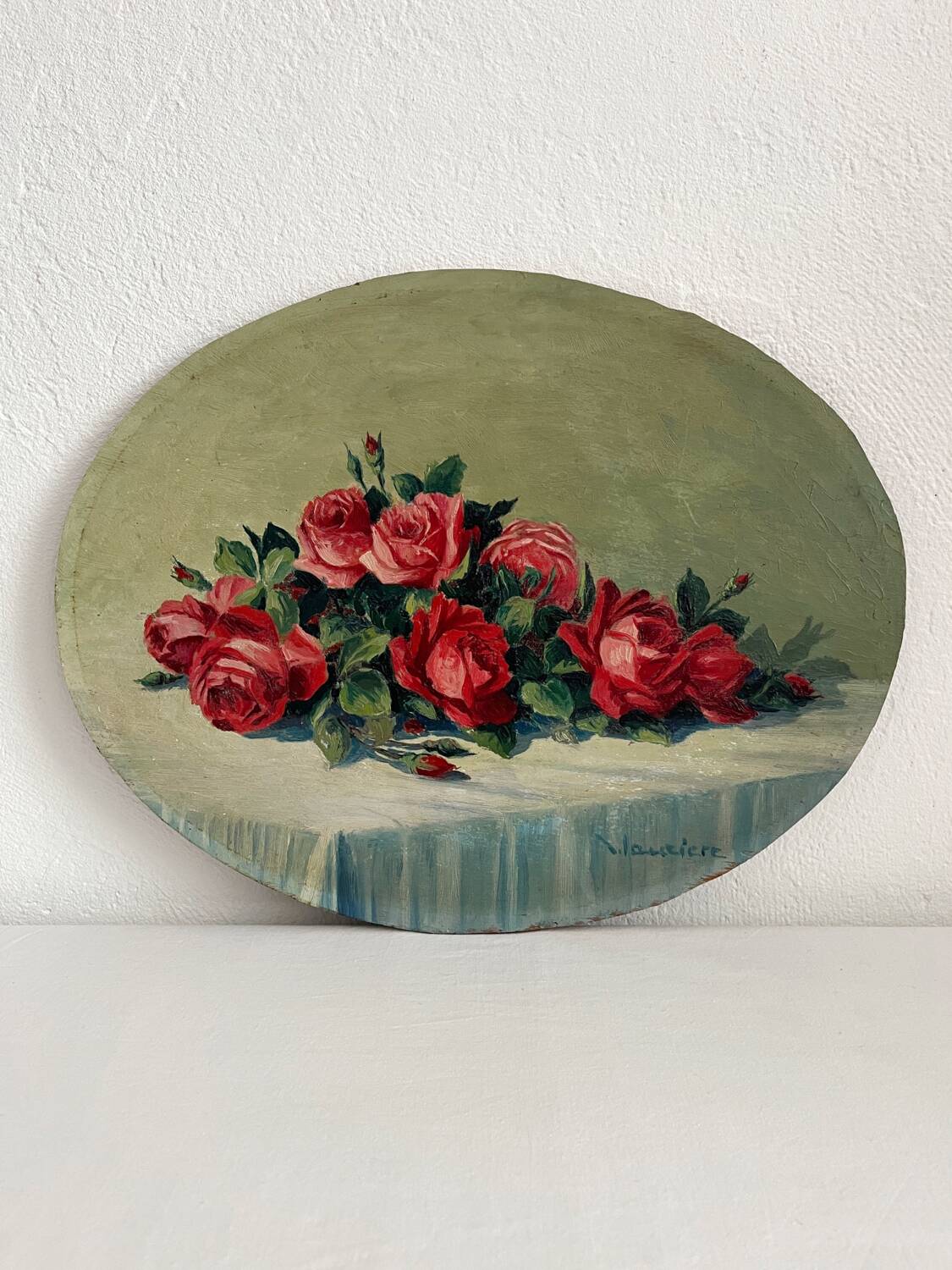 Old oil painting on oval wood with roses thrown from the 30s