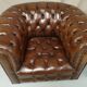 Pair of Chesterfield brown leather armchairs