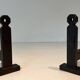 Pair of Minimalist Modernist Wrought Iron Chenets with Torch Holders in Nut Design
