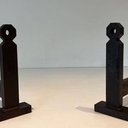 Pair of Minimalist Modernist Wrought Iron Chenets with Torch Holders in Nut Design