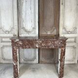 Red marble fireplace in the Louis XVI style, late 19th century