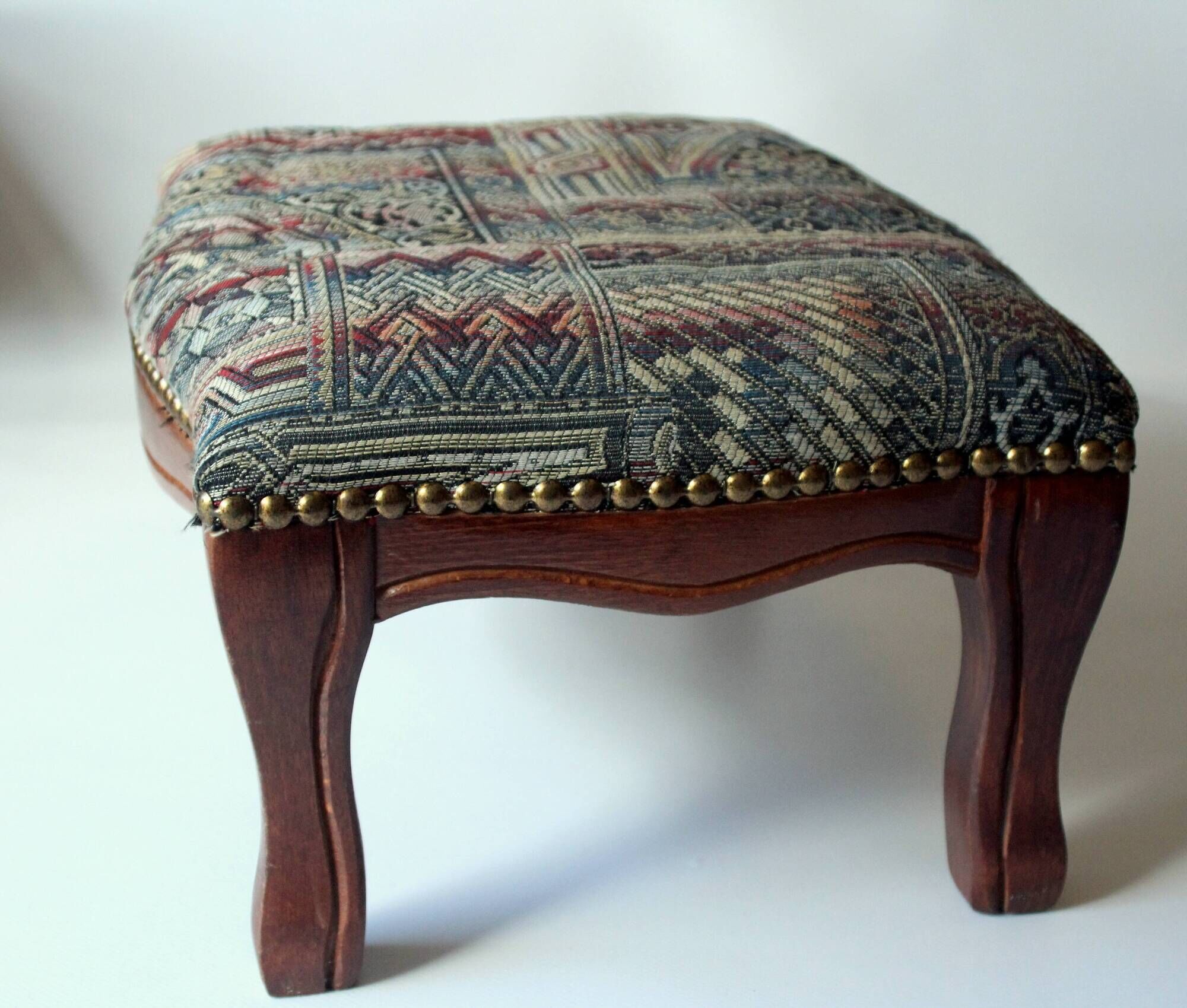 Small foot stool made of wood with upholstery, vintage from the 70s