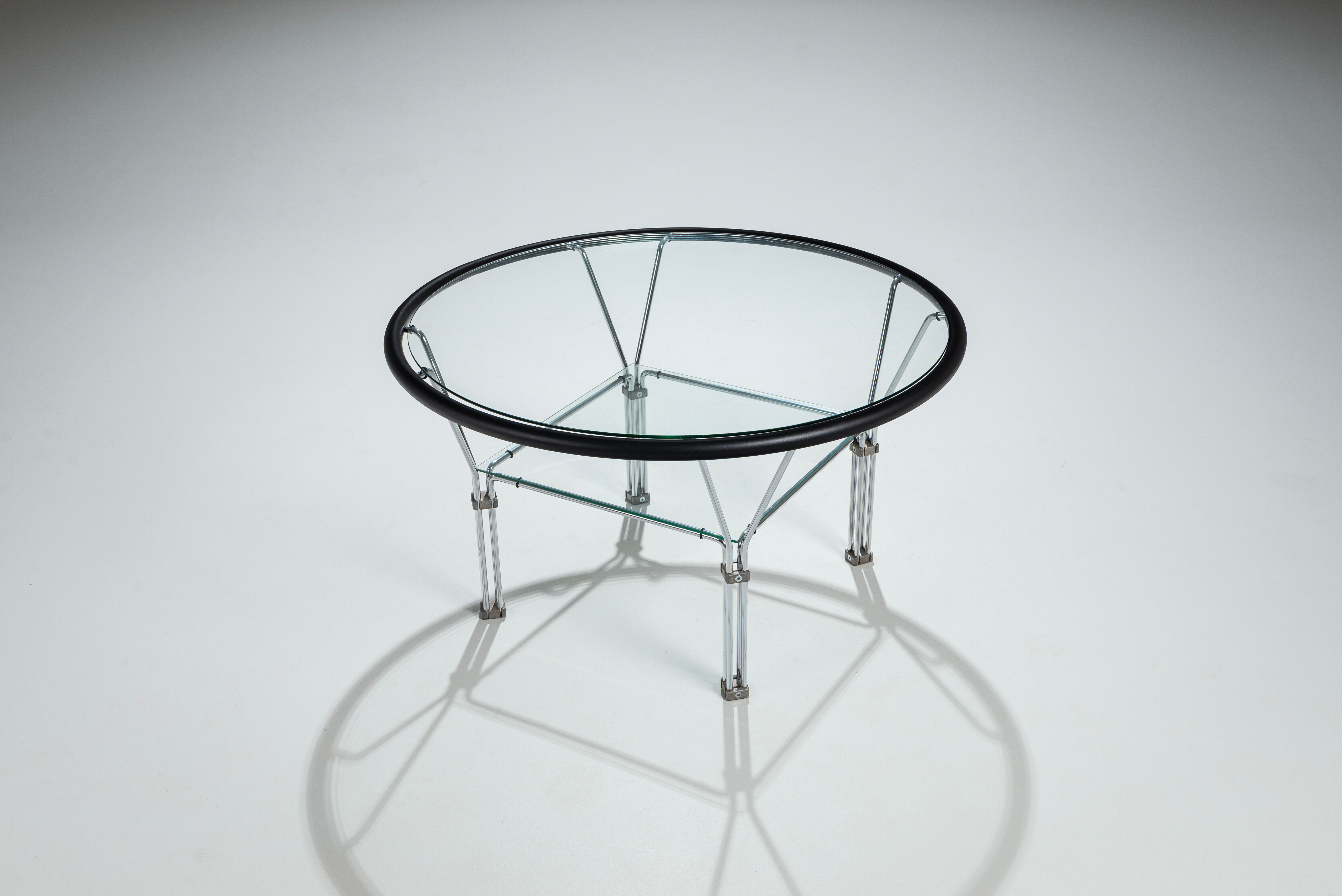 Post-Modern round glass and steel coffeetable attributed to Niels Bendtsen