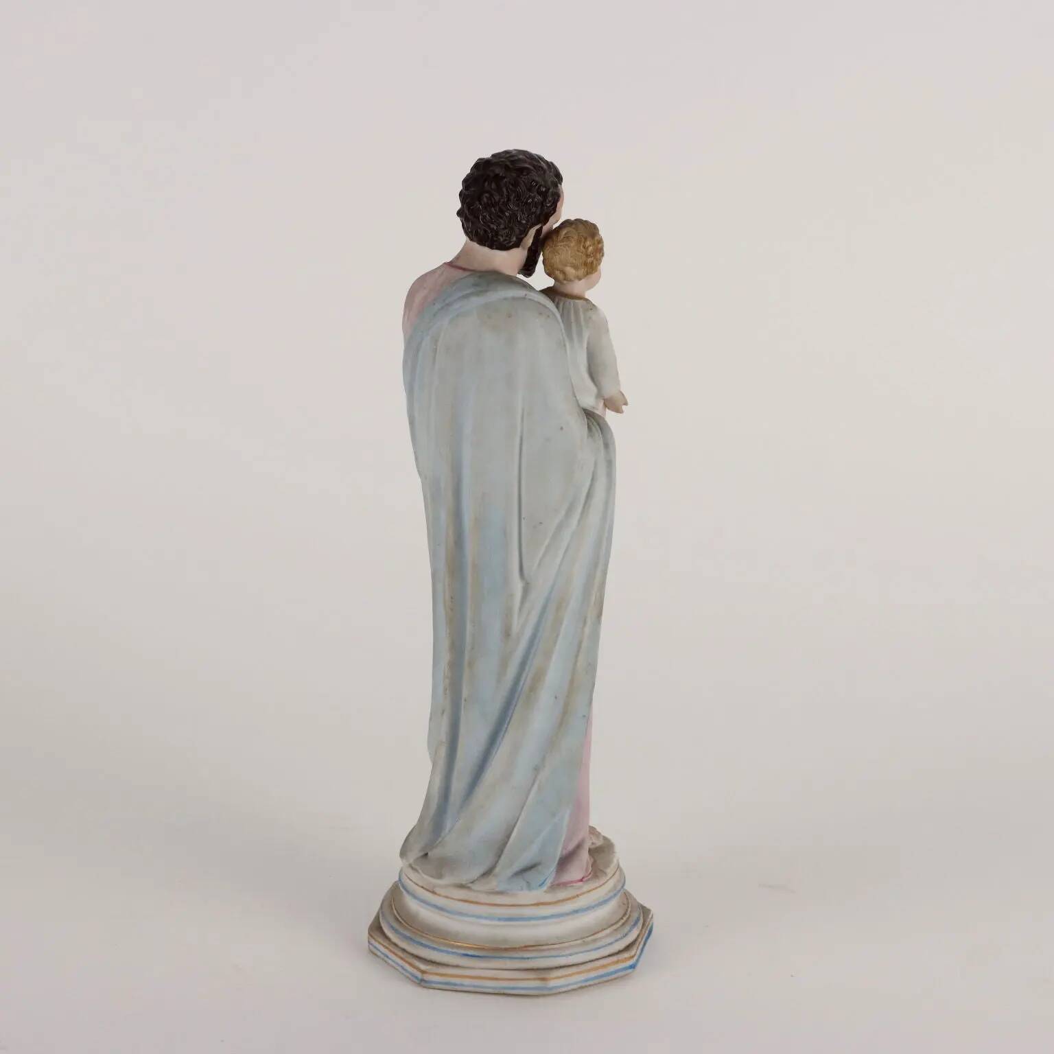 Ancient sculpture of Saint Joseph in a display case, Italy 1900s, polychrome porcelain.