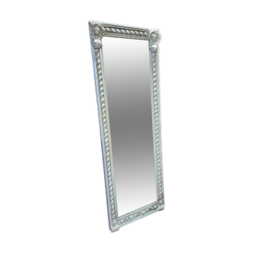 Beige patinated mirror with women's heads