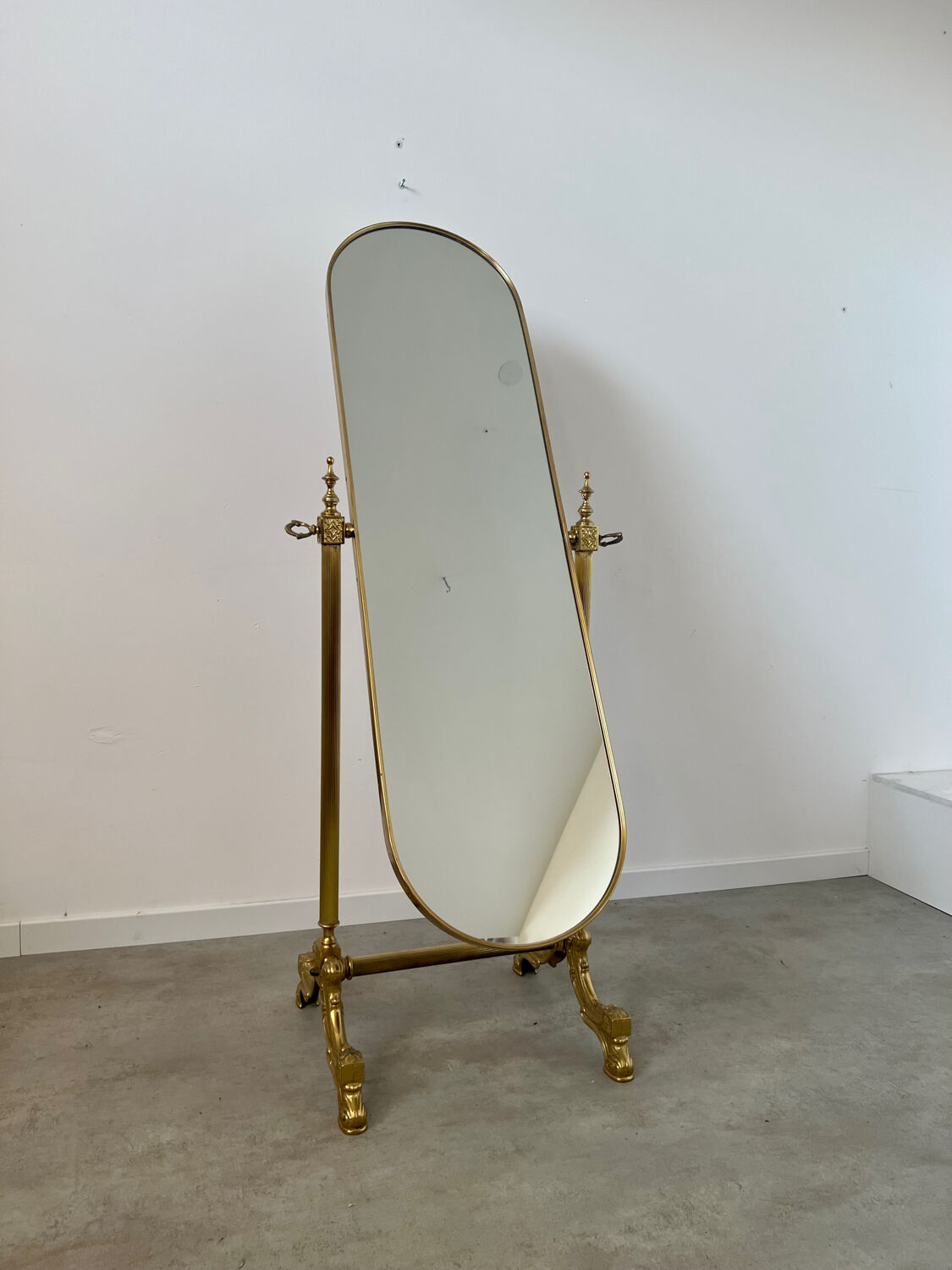 Old free-standing mirror in gilded brass in psychedelic neoclassical style Years 40 France