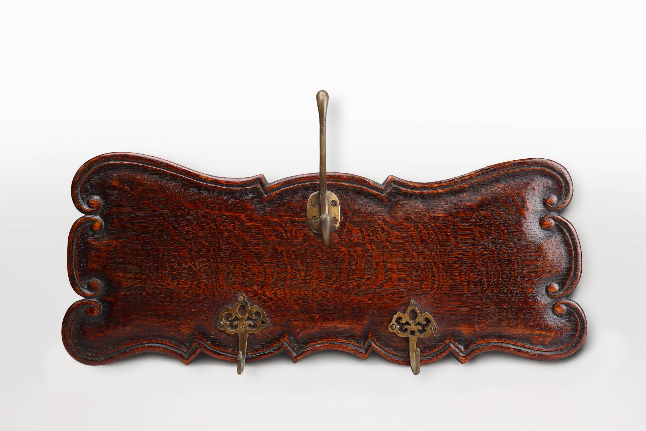 Art Nouveau style coat rack in oak with brass hooks, France ca. 1915