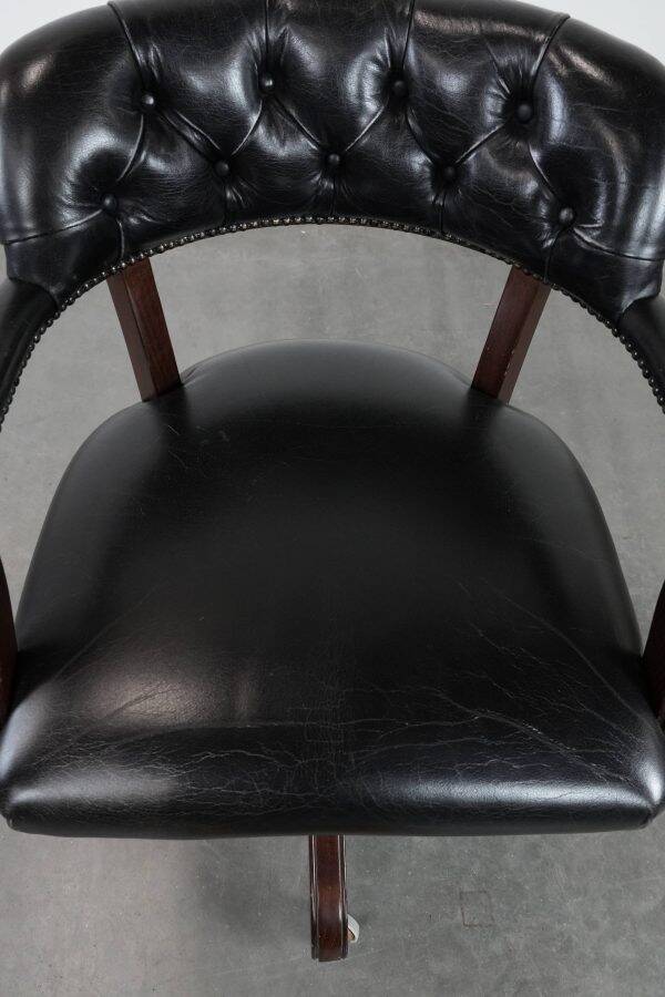 Adjustable black timeless Chesterfield office chair made of cow leather
