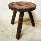 Carved wooden tripod stool