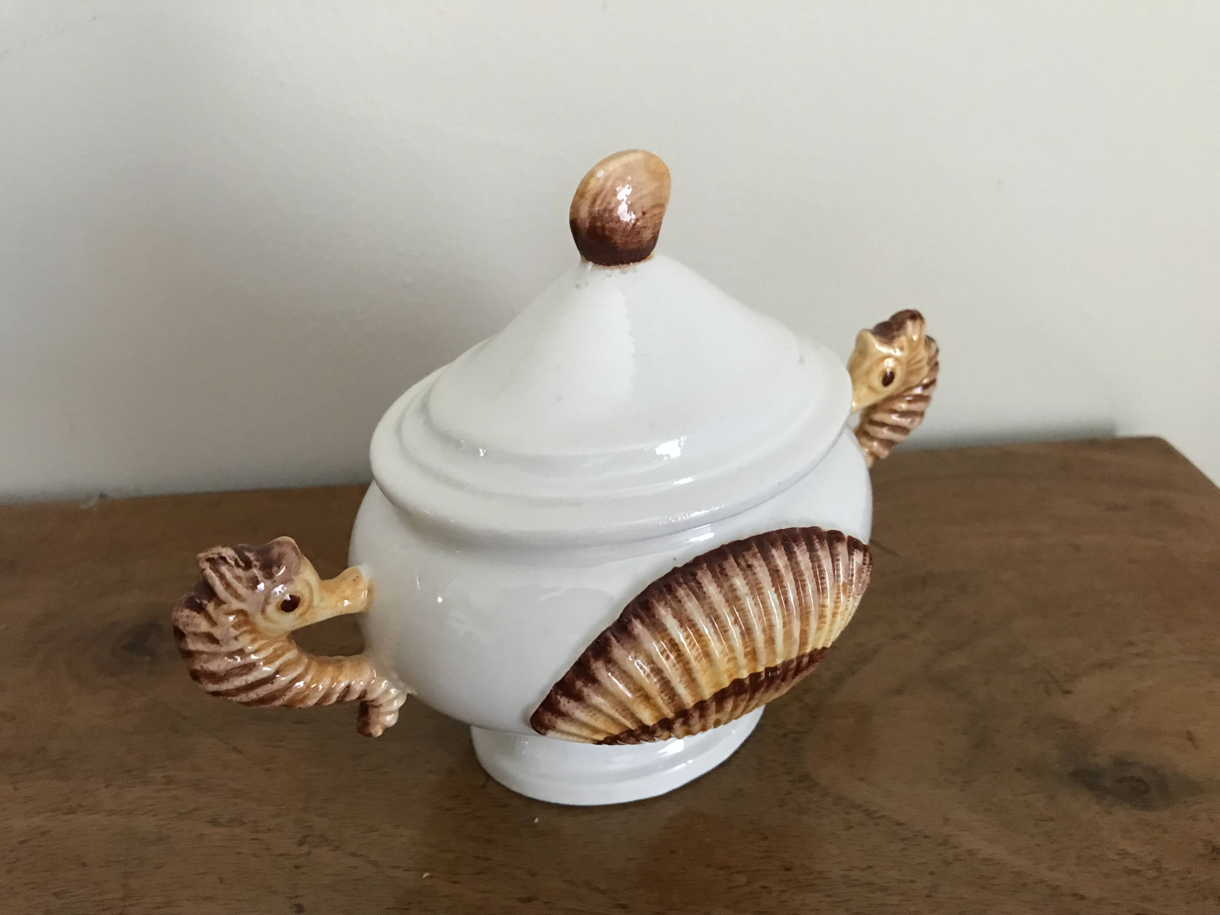 Zoomorphic covered pot decorated with seahorses
