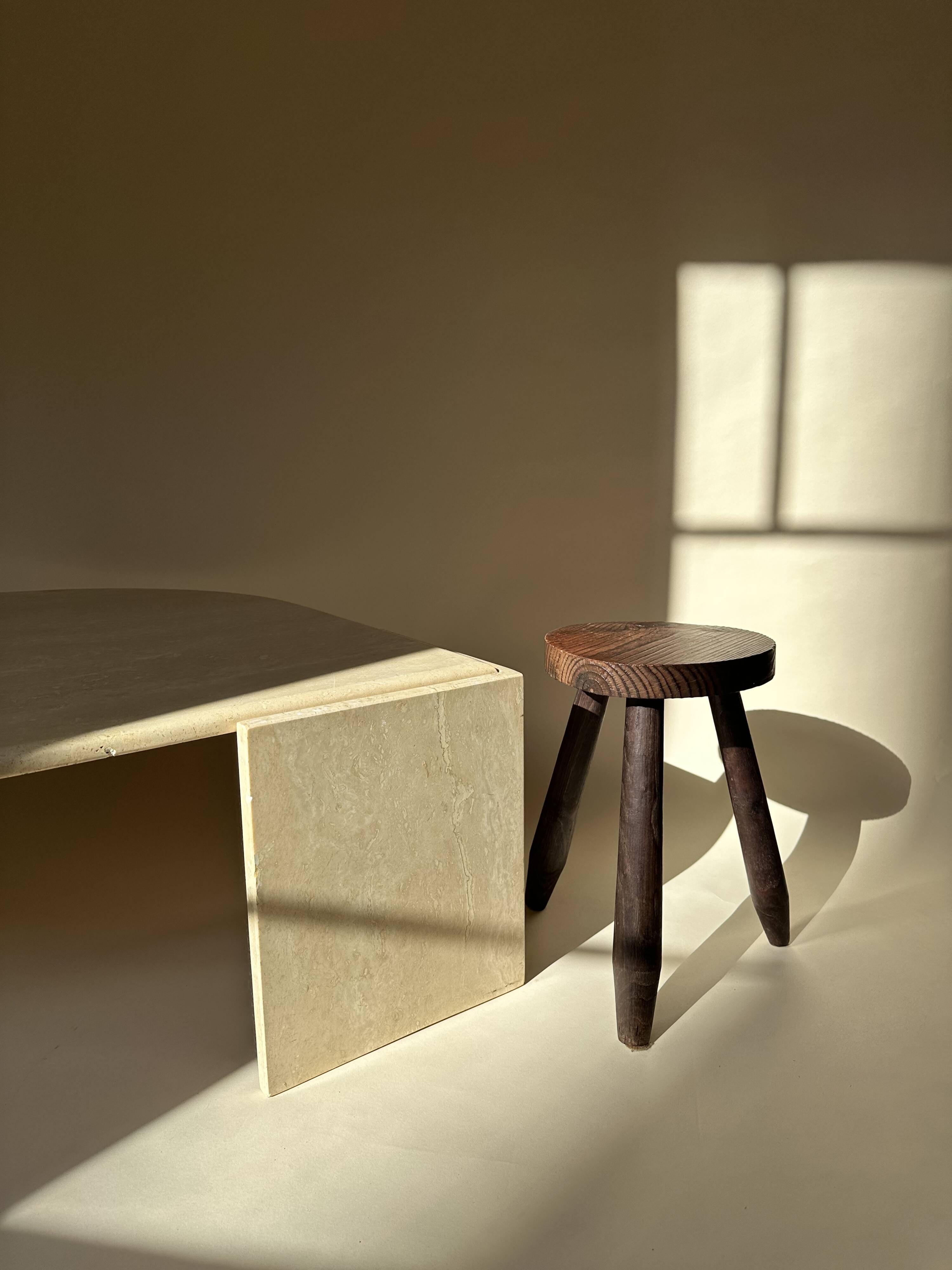 Travertine eye-shaped coffee table