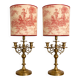 Pair of lamps in gilded brass, red toile de Jouy shades.