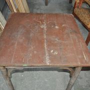 Rustic Thonet table in brown beech, circa 1920, with slatted top and turned legs.