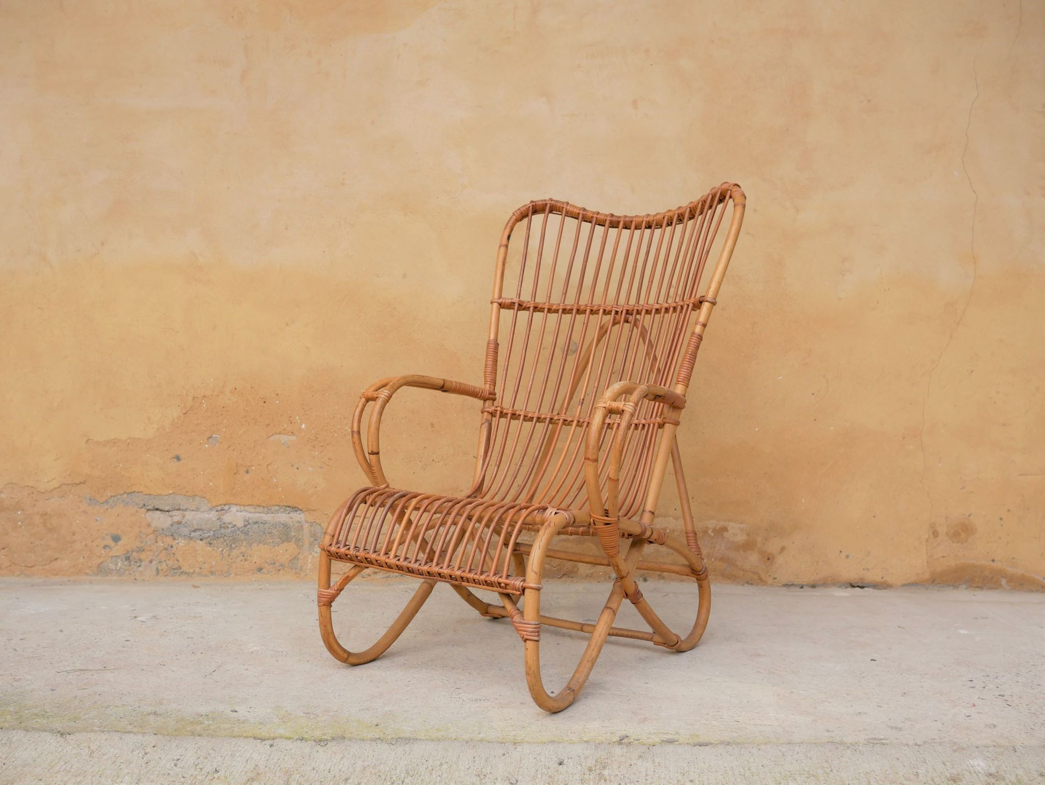 Vintage rattan chair by Louis Sognot