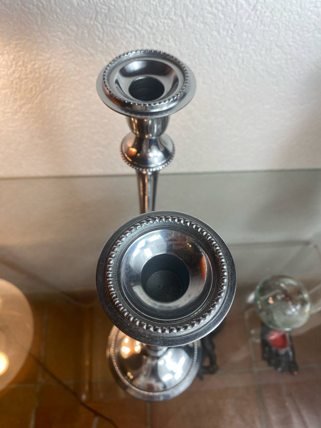 Pair of silver-plated metal candlesticks