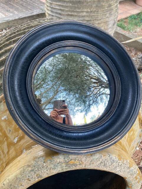 Convex mirror, also known as a witch's mirror.