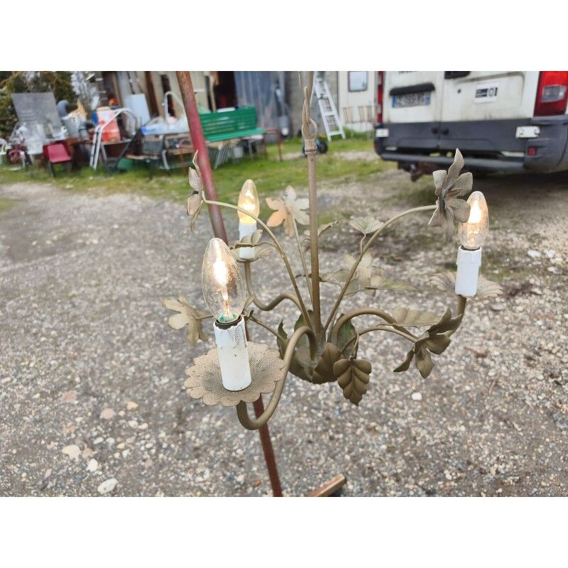 Vintage gold metal chandelier with floral decoration.