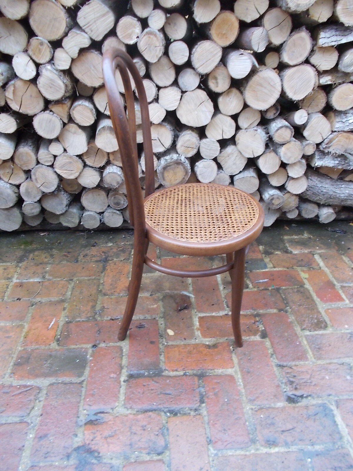 Curved wooden bistro chair and canning