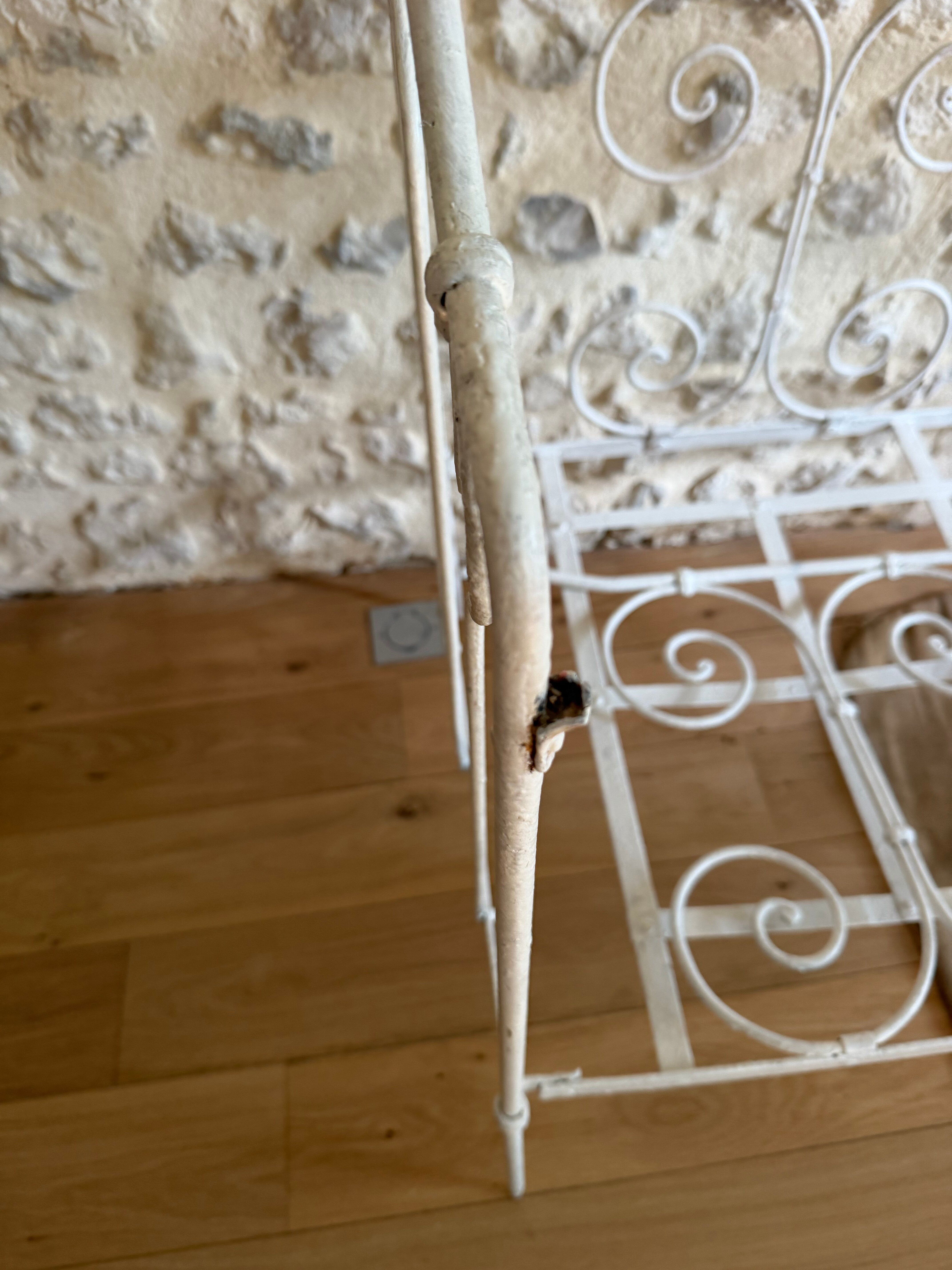 Small renovated wrought iron bed