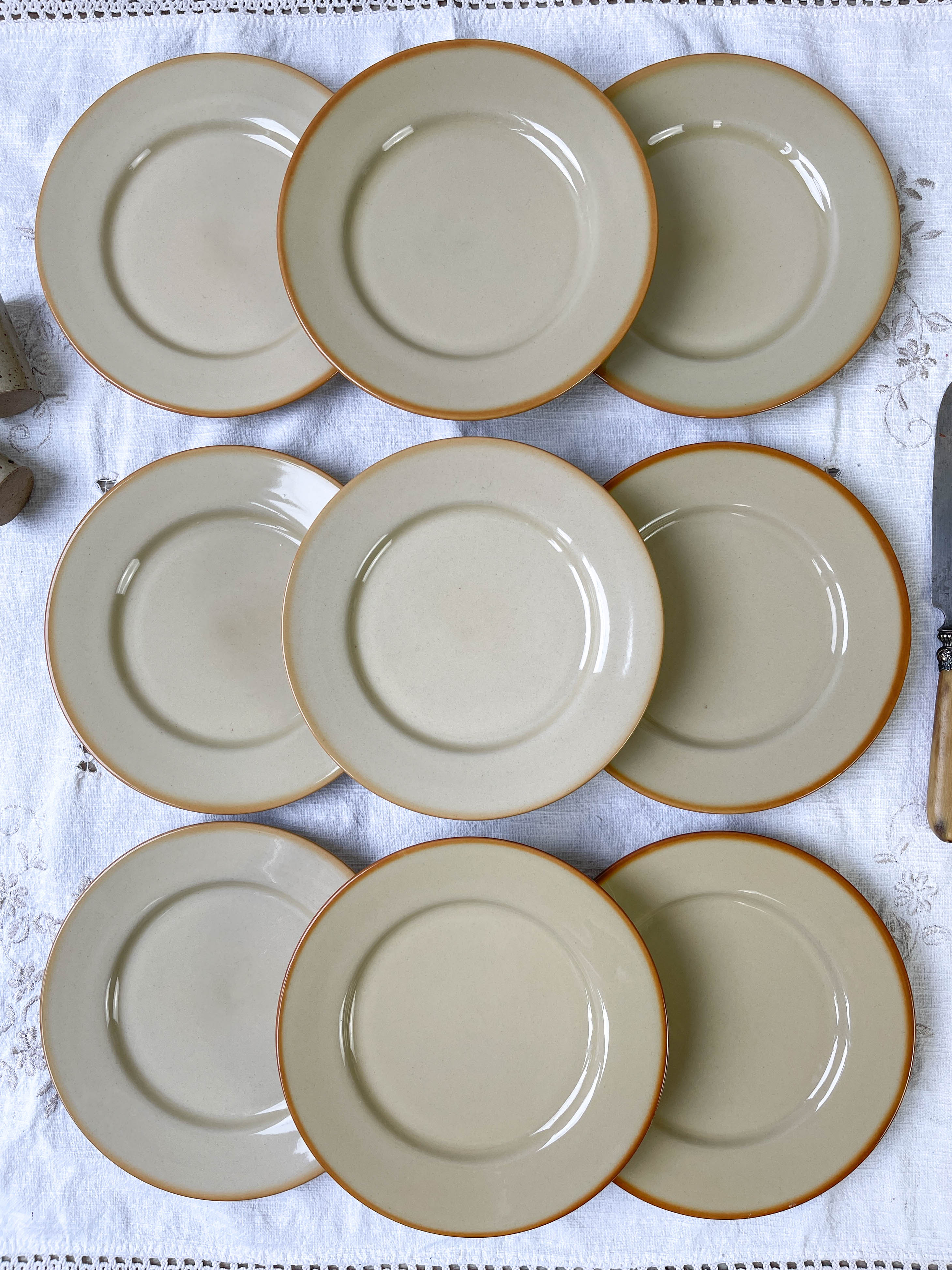 9 mid-century beige Tulowice stoneware plates