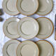 9 mid-century beige Tulowice stoneware plates