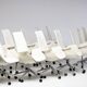 Neuf chaises à dossier haut en cuir blanc sur roulettes par Fabricius & Kastholm.