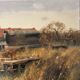 Village by the water, oil on paper signed