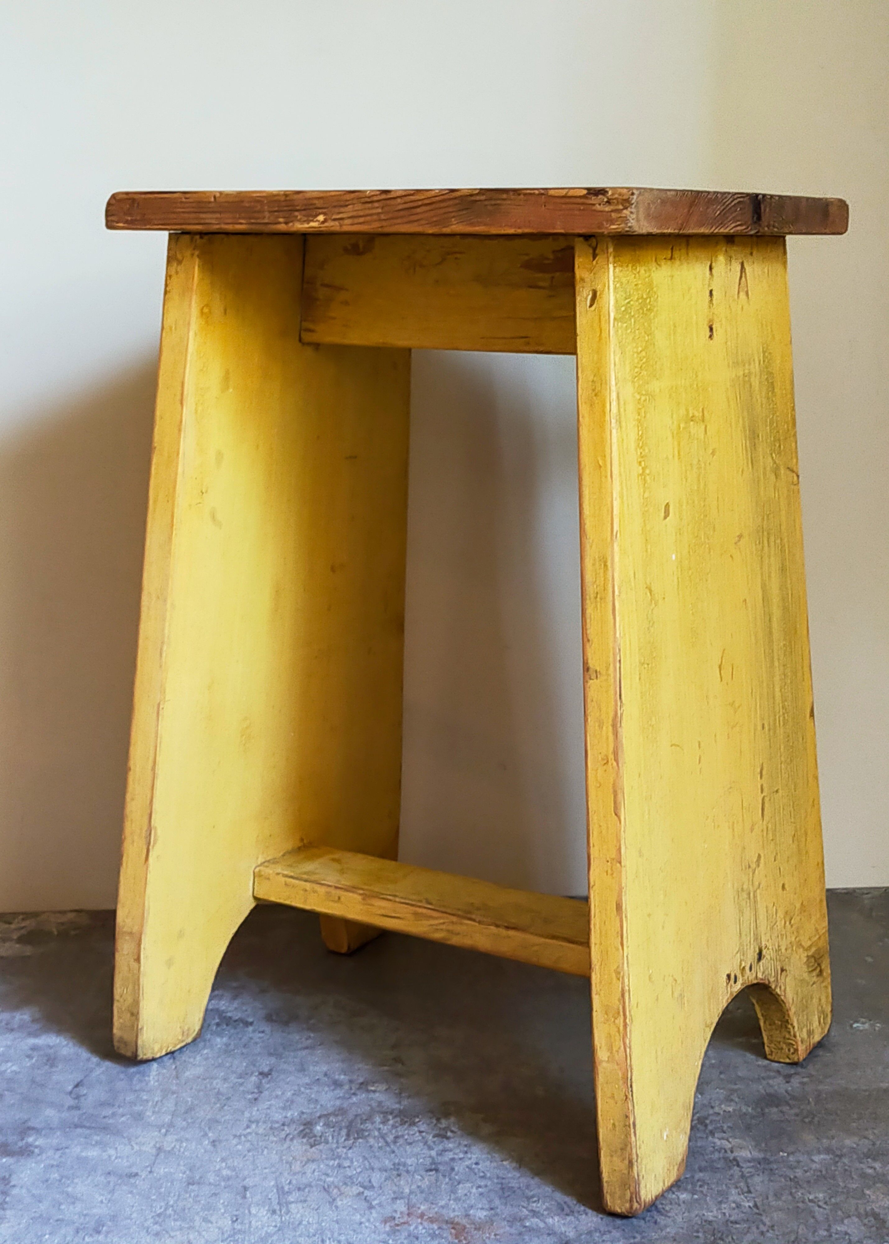 Art-populaire workshop stool in patinated painted wood