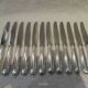 12 silver plated dessert knives by Christofle Vendome, 20.3cm