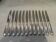 12 silver plated dessert knives by Christofle Vendome, 20.3cm