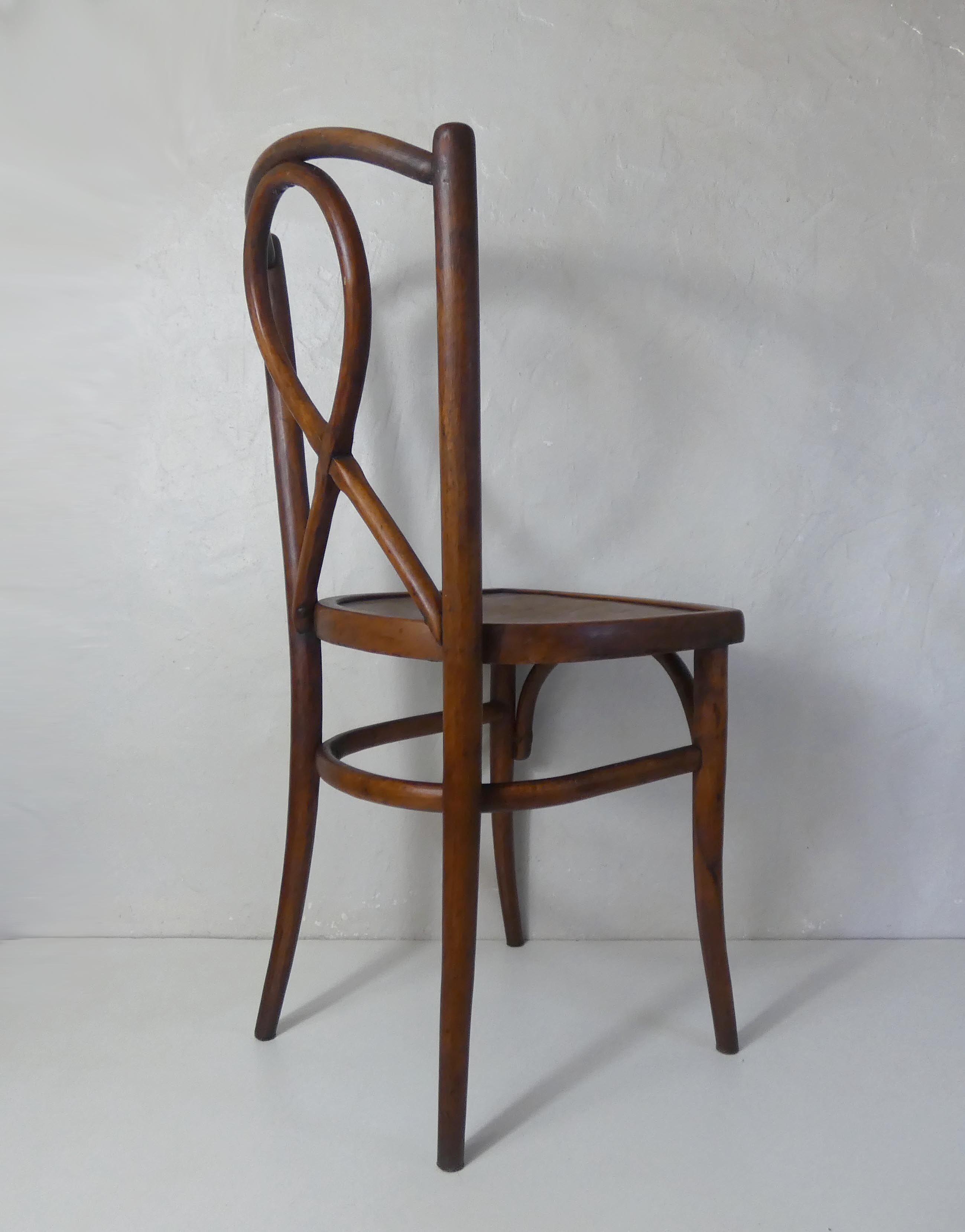 Old curved wooden bistro chair