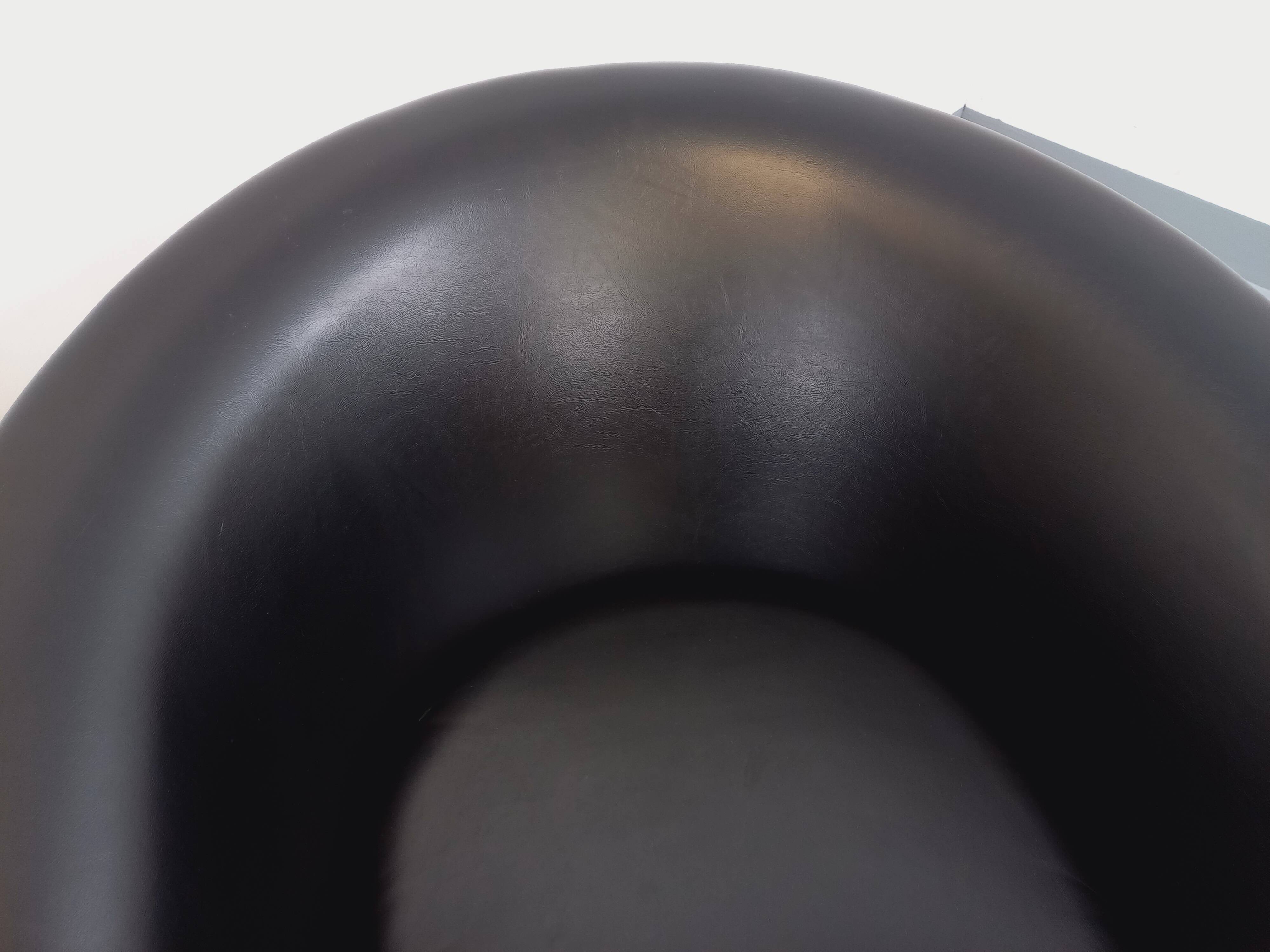 Pair of vintage Scandinavian swivel armchairs in faux leather and chrome.