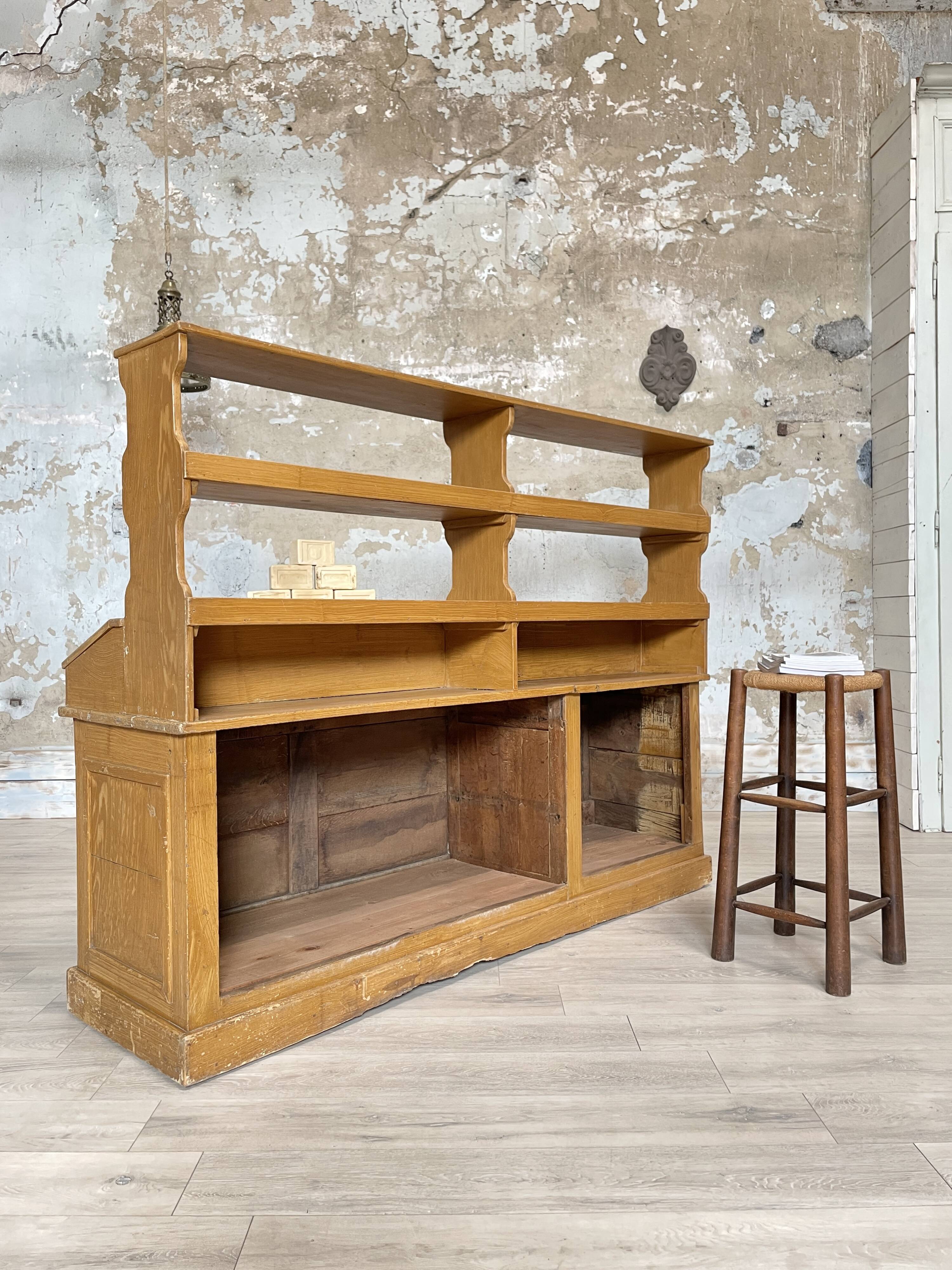 Wooden hardware cabinet painted with wood effect, circa 1940.