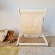Old white wood deck chair Triconfort