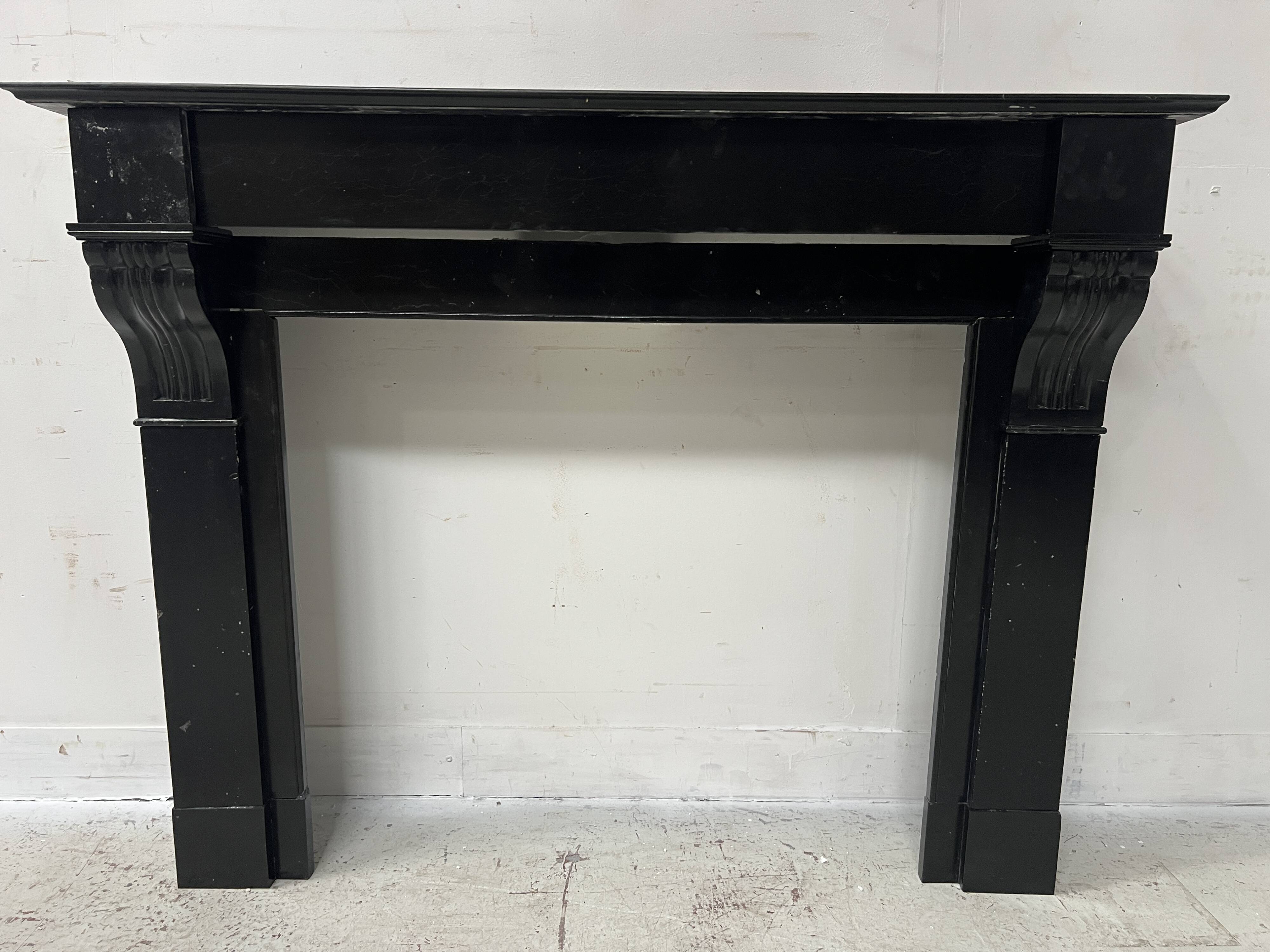 Napoleon III period fireplace with a black marble corbel. 19th century.